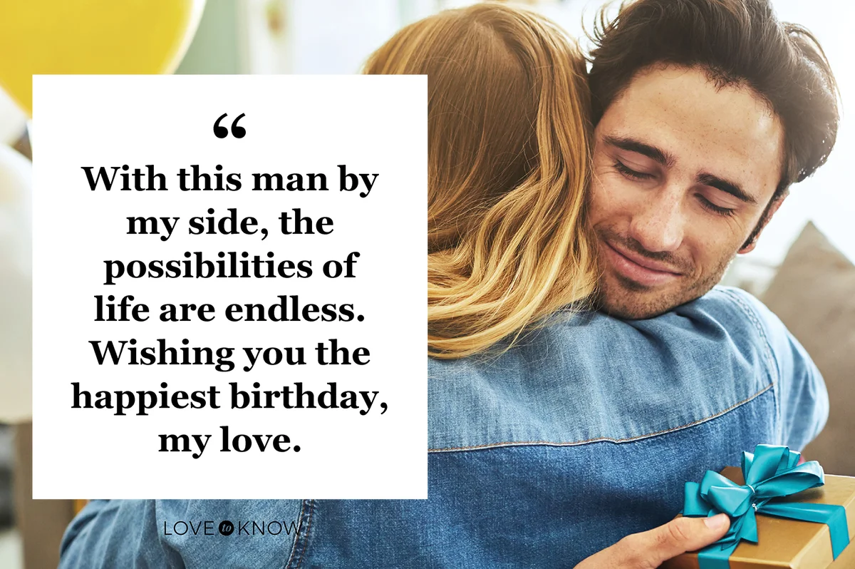 Cheerful young man hugging his wife after receiving a gift from her at home