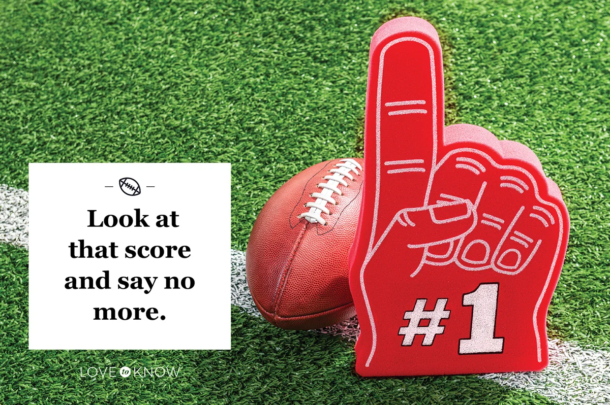 A red #1 foam hand with an American Football stadium