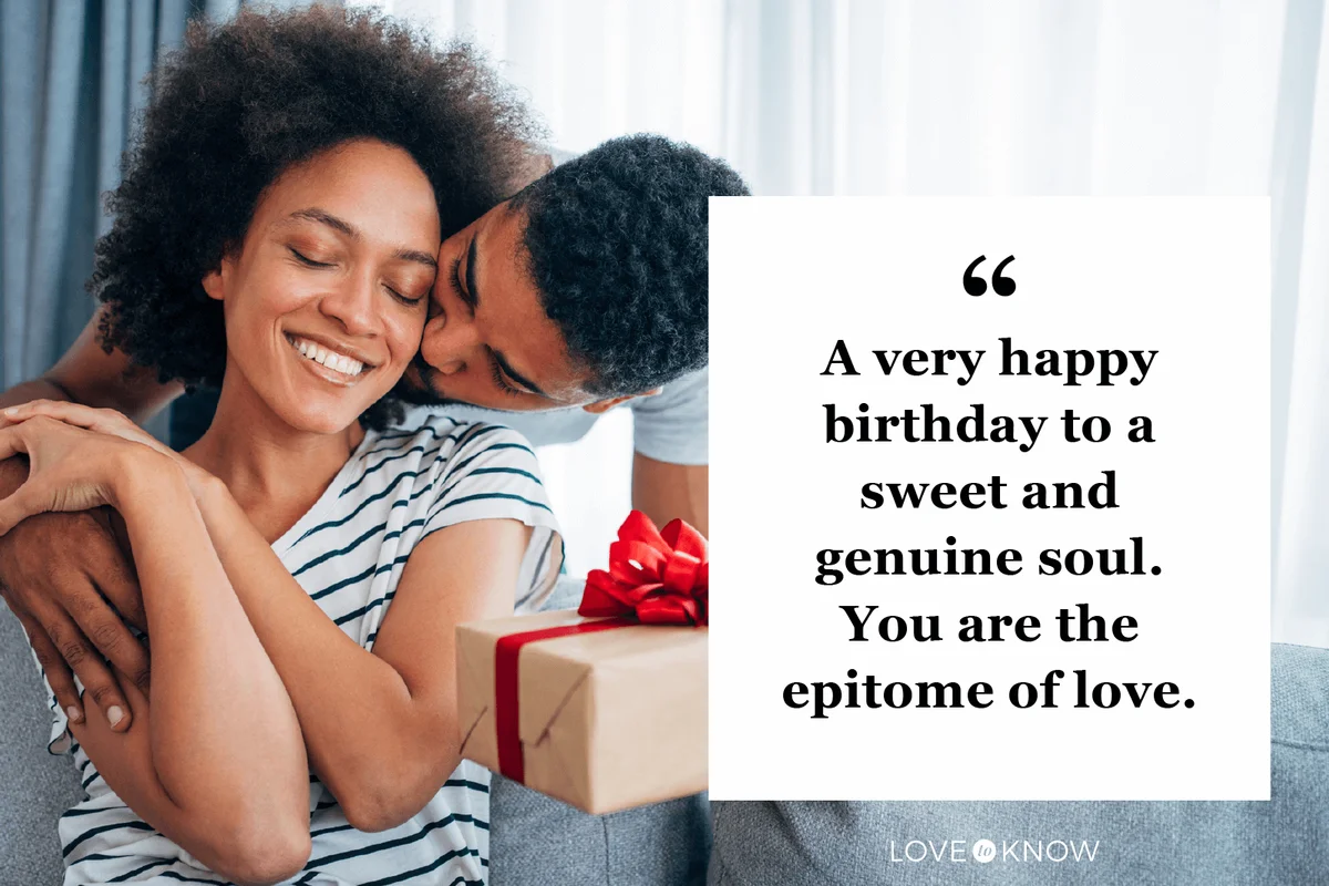 Cheerful young woman receiving a gift from her boyfriend