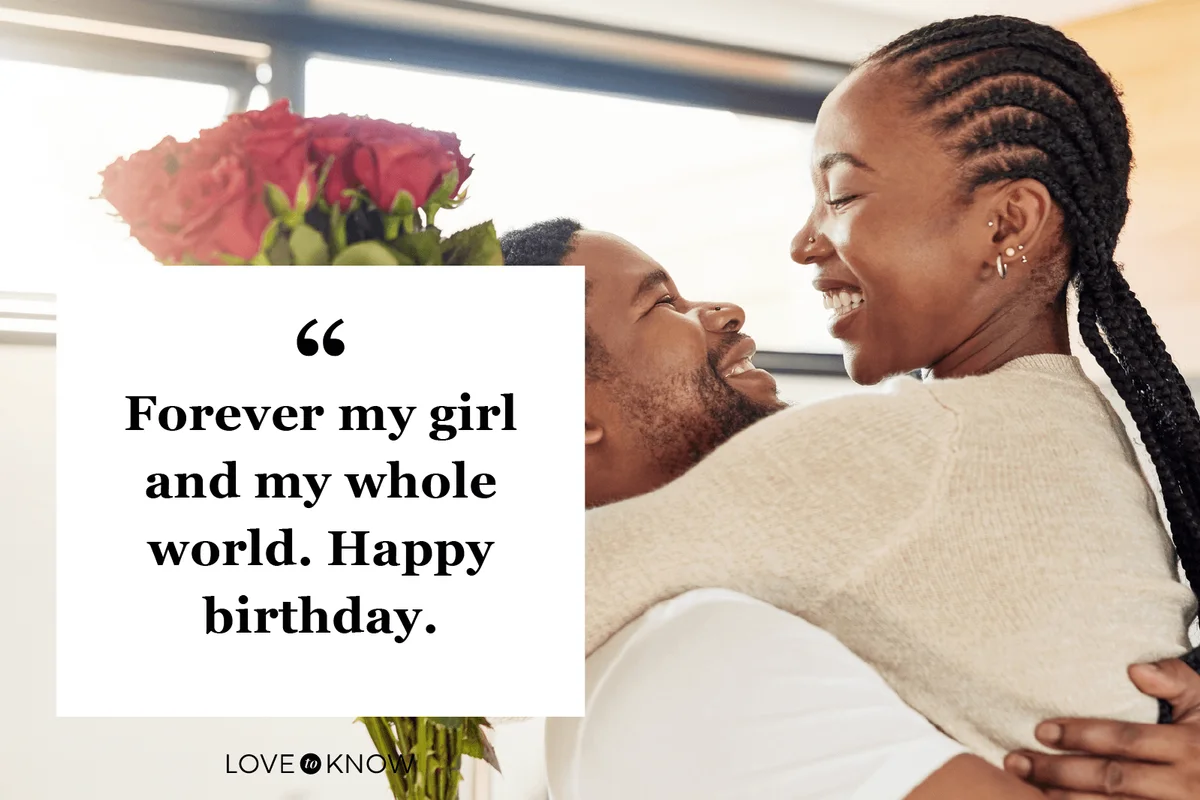 man surprising his wife with a bunch of flowers at home