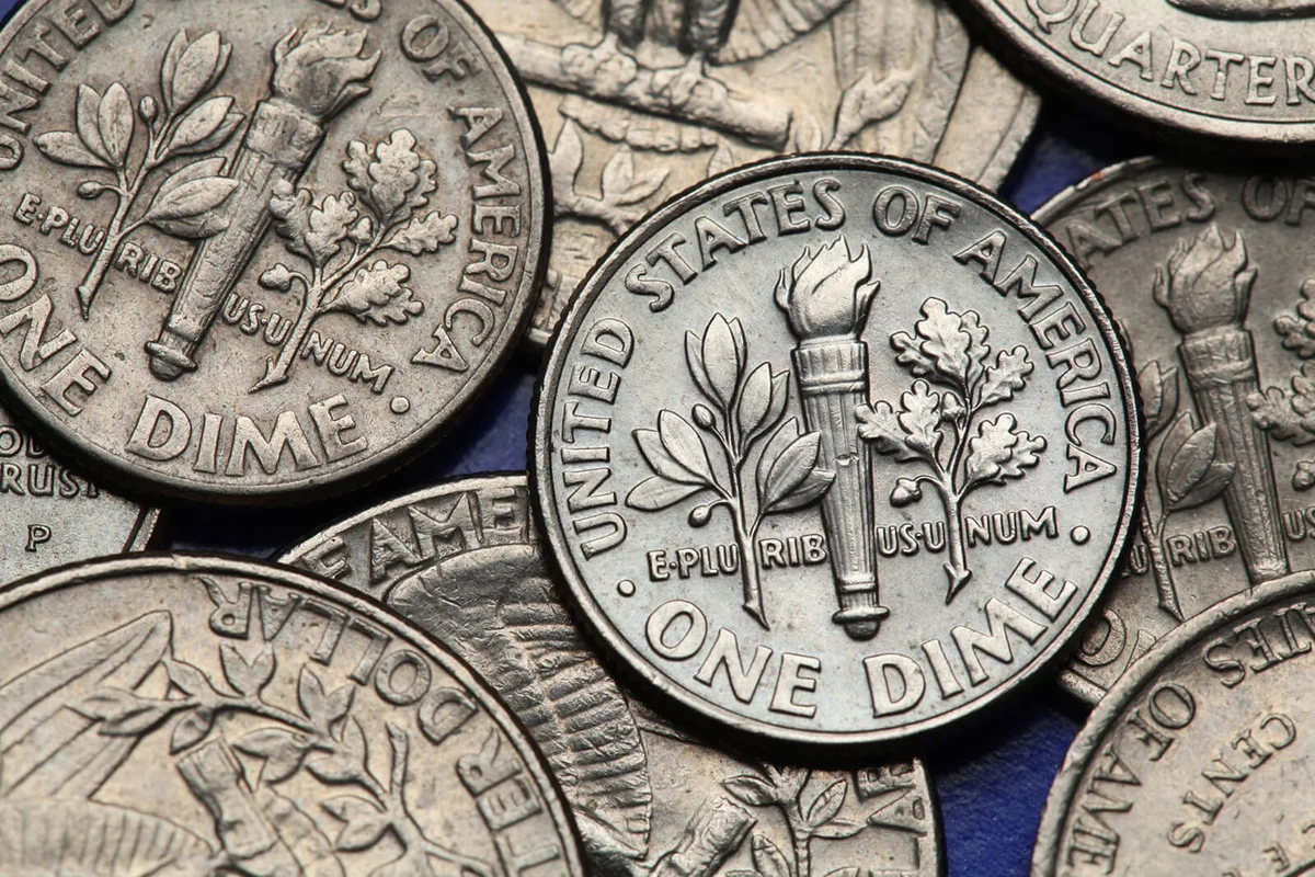 Coins of USA. Torch, oak branch and olive branch depicted on the US dime coin