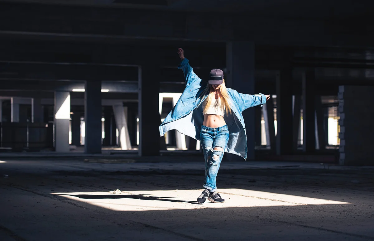 Female dancer dancing in abandoned building