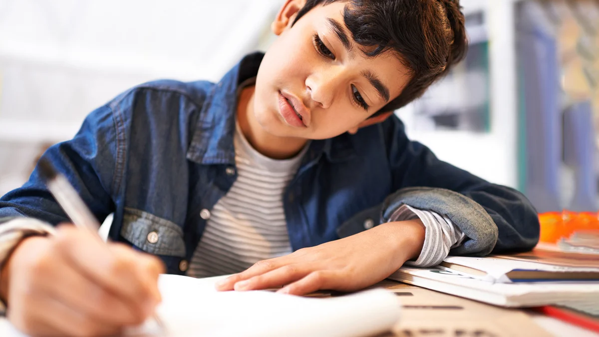 young boy doing his homework