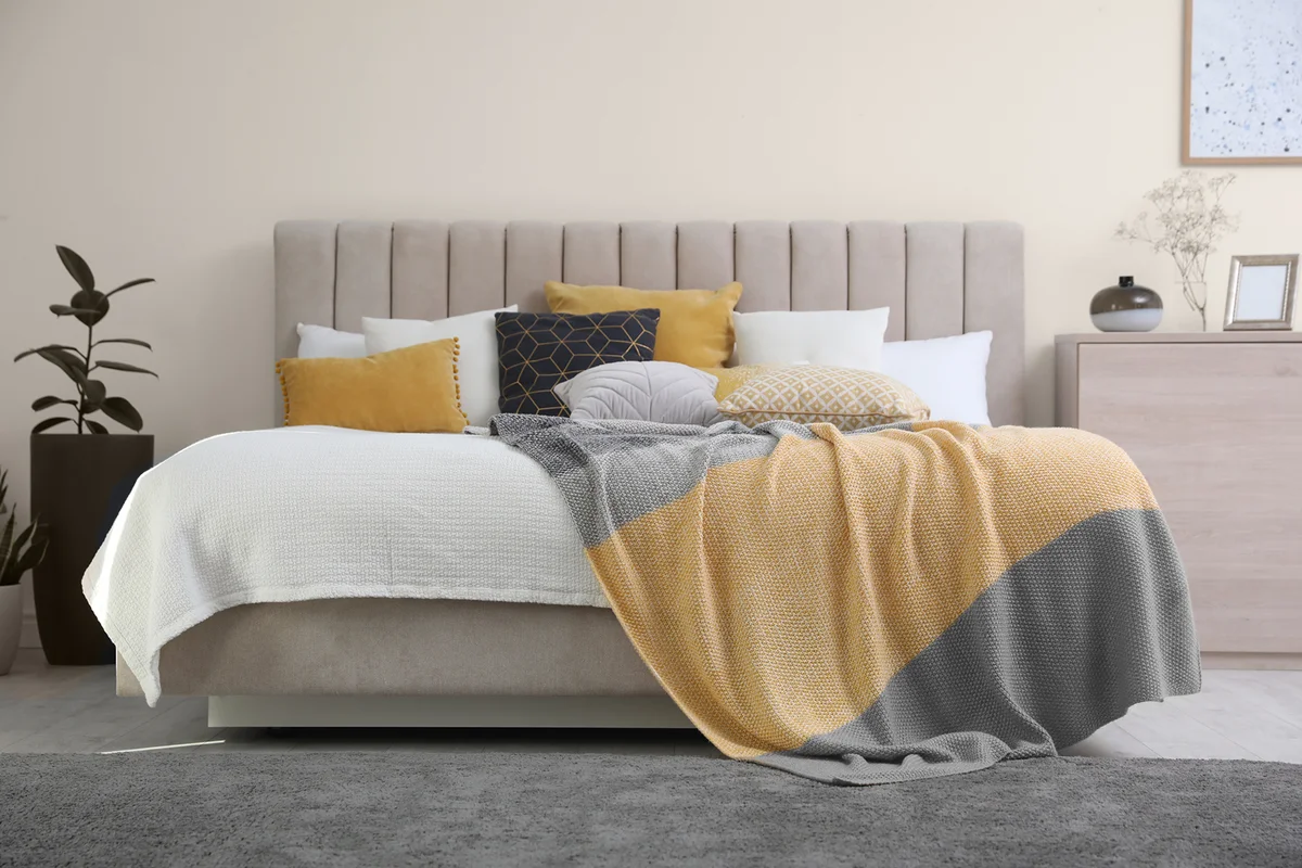 Stylish interior of contemporary room with comfortable bed