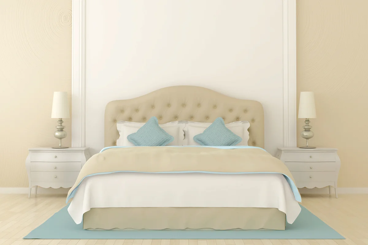 Bedroom in soft beige colors with blue decoration.