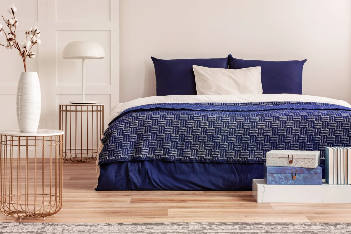 King size bed with navy blue bedding