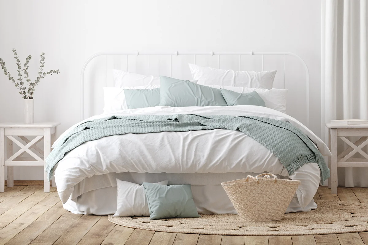 Light farmhouse bedroom interior with blank wall