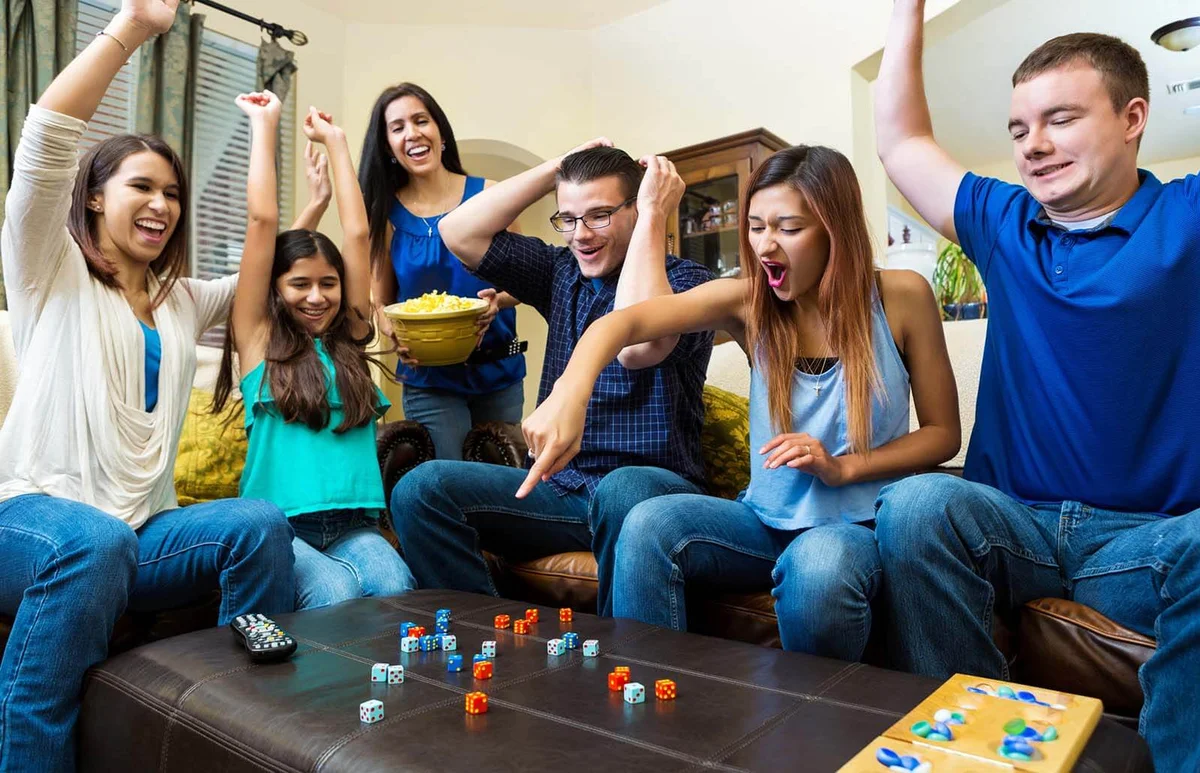 adult friends playing competitive dice game