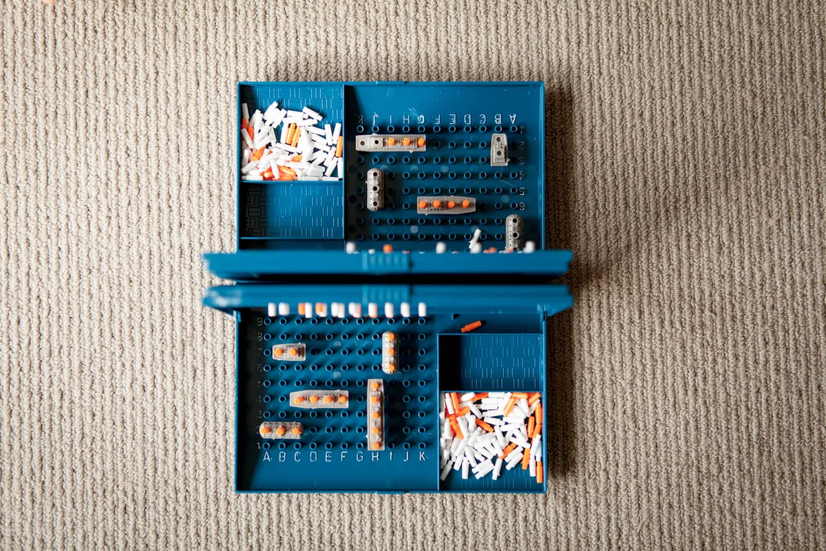 Blue battle ships game played indoors on carpet