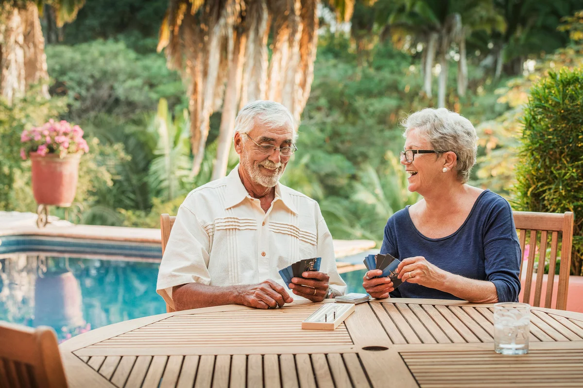 Senior Couple playing cribbage outdoors