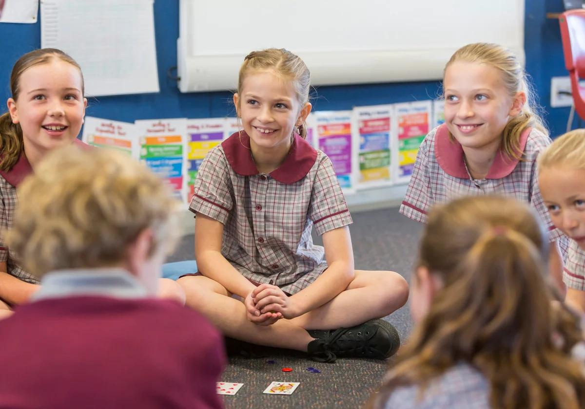 Children Sitting Playing Ranter-Go-Round card game