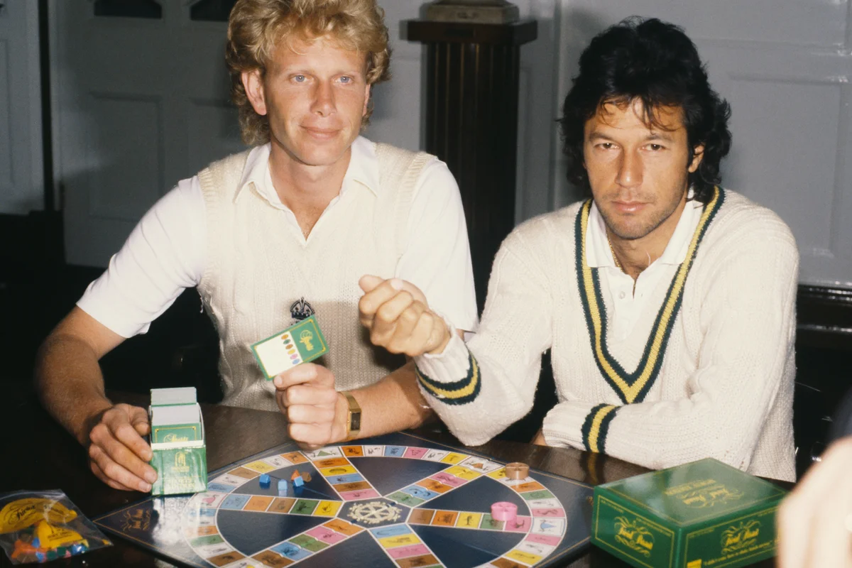Cricketers Imran Khan (right) and Graham Dilley (1959 - 2011) at the launch of the sports edition of board game Trivial Pursuit, 1987. - Getty Editorial Use