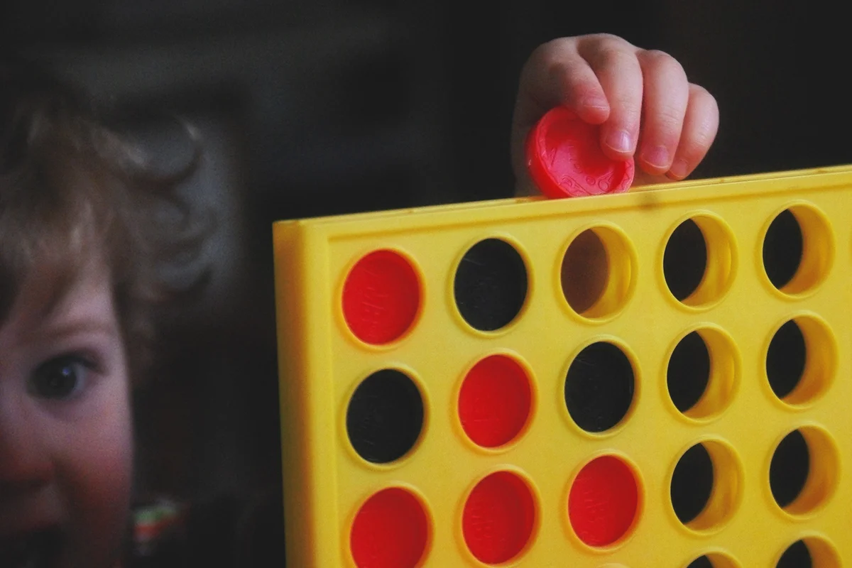 Girl playing Connect Four