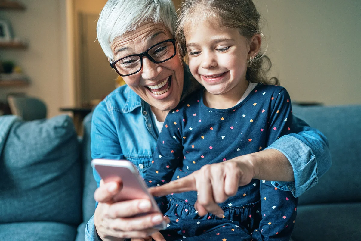 grandmother and granddaughter playing