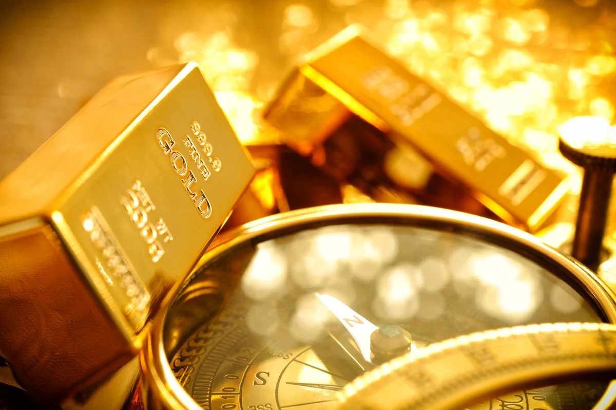 Gold bars and a compass