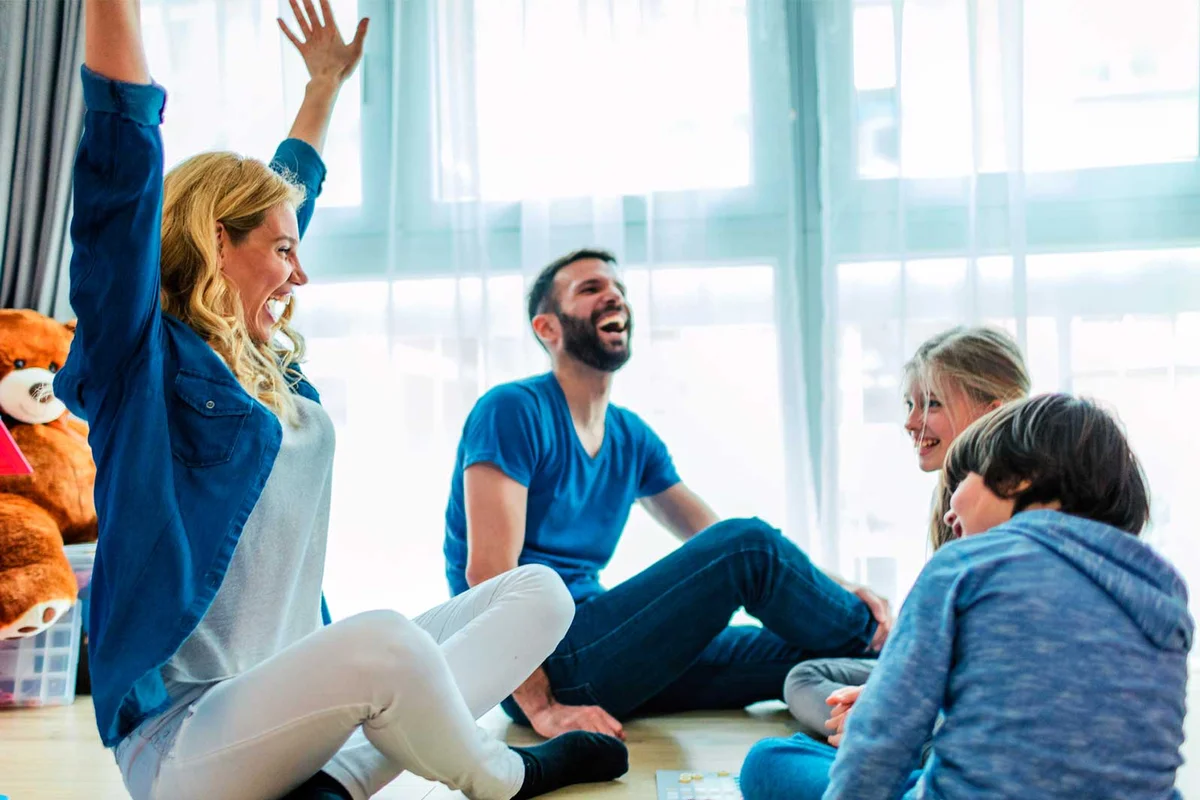 family playing board game