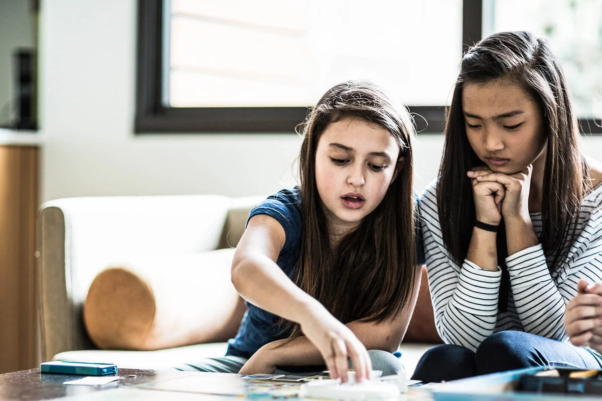 girls playing boardgame