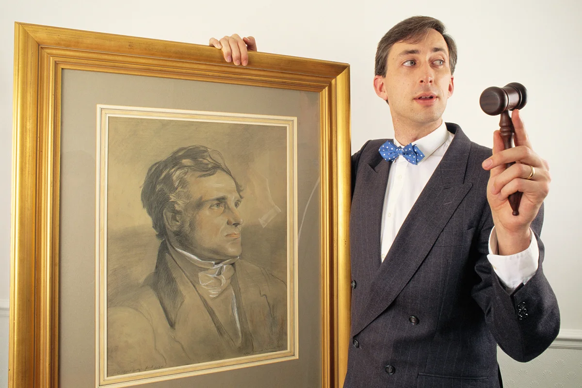 Auctioneer with old painting