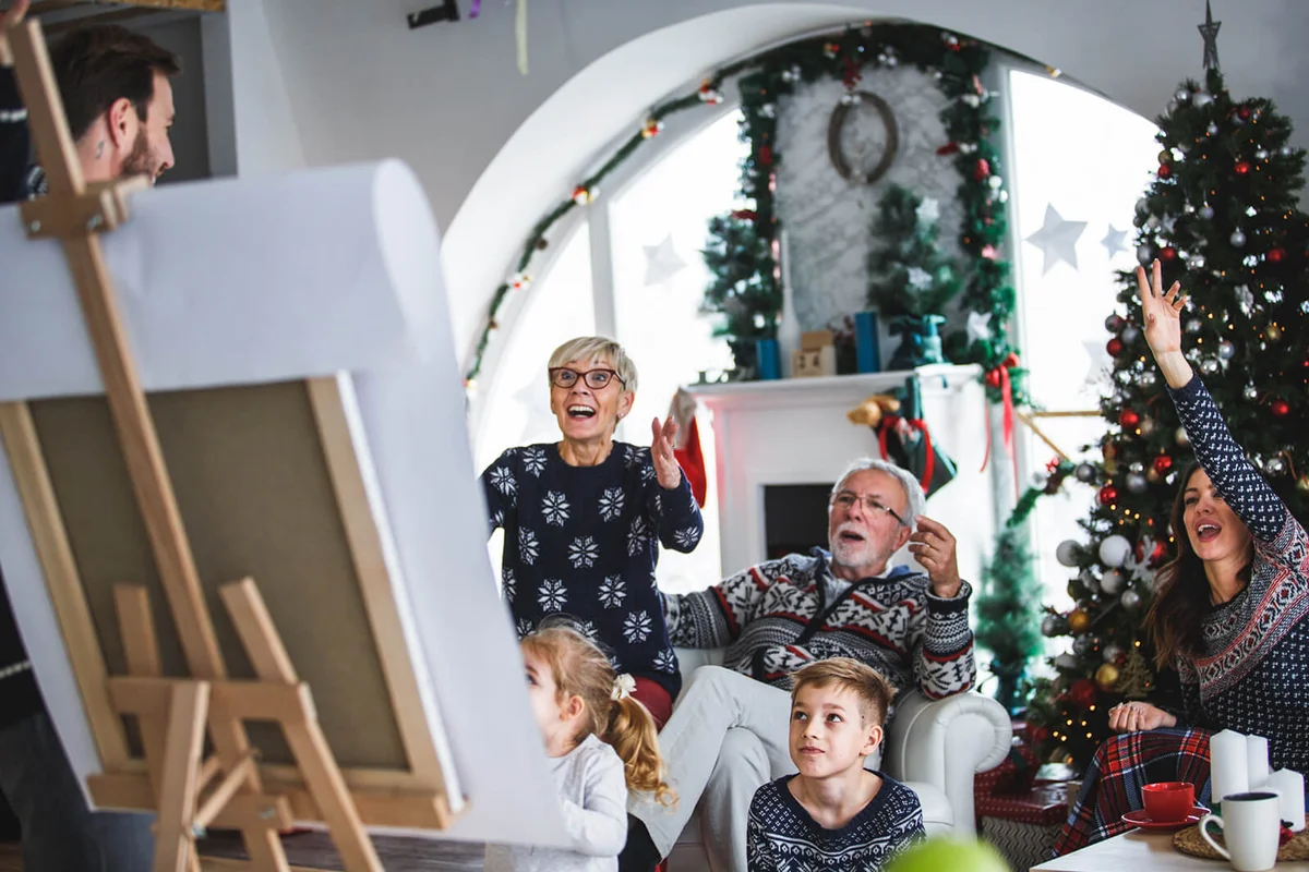 Multi generation family shouting while playing indoor games