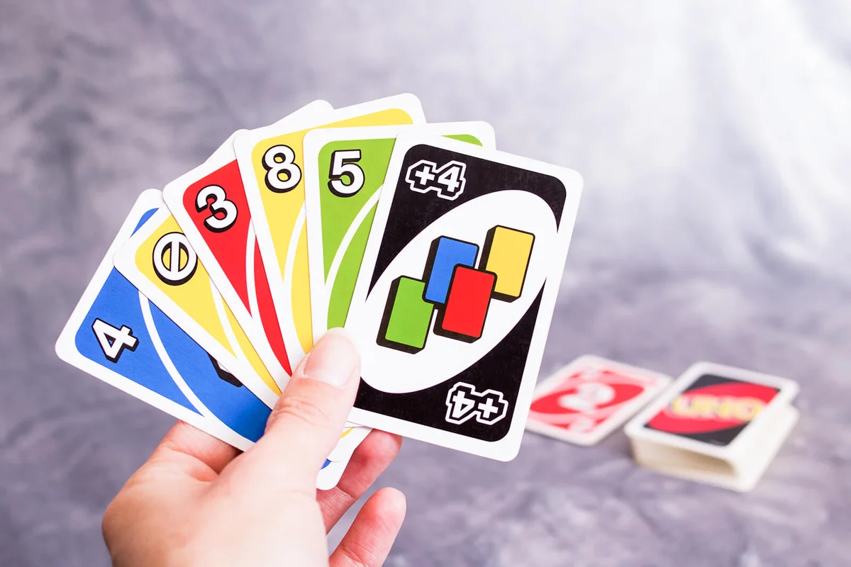 Uno cards in hand | Photo 207670726 / Uno Cards © Vera Aksionava | Dreamstime.com