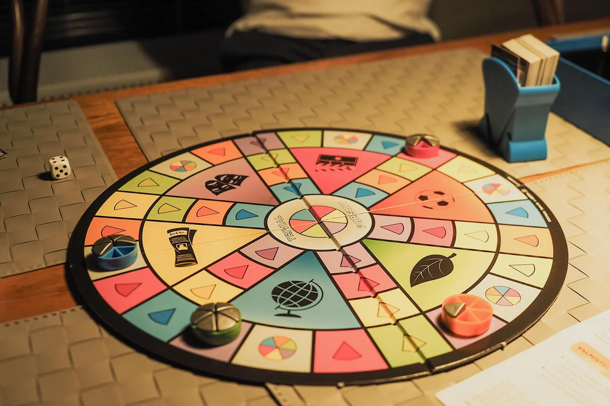 A four-player game of Trivial Pursuit Party at the end of play