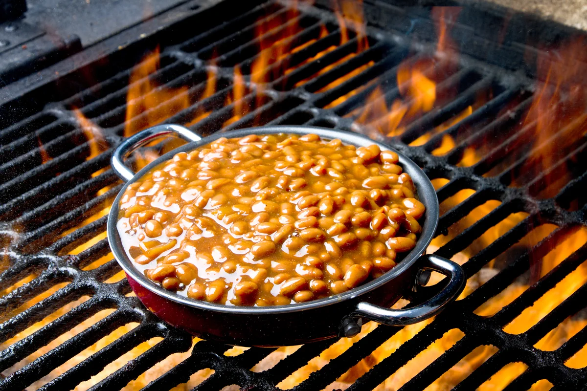 Pot of Baked Beans on a Flaming Grill