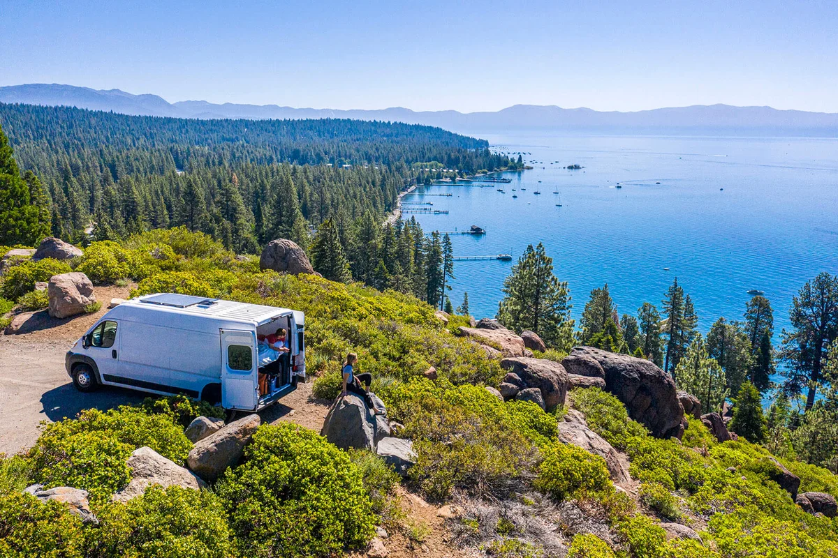 Young Couple Parked Van at a Viewpoint of Lake Tahoe