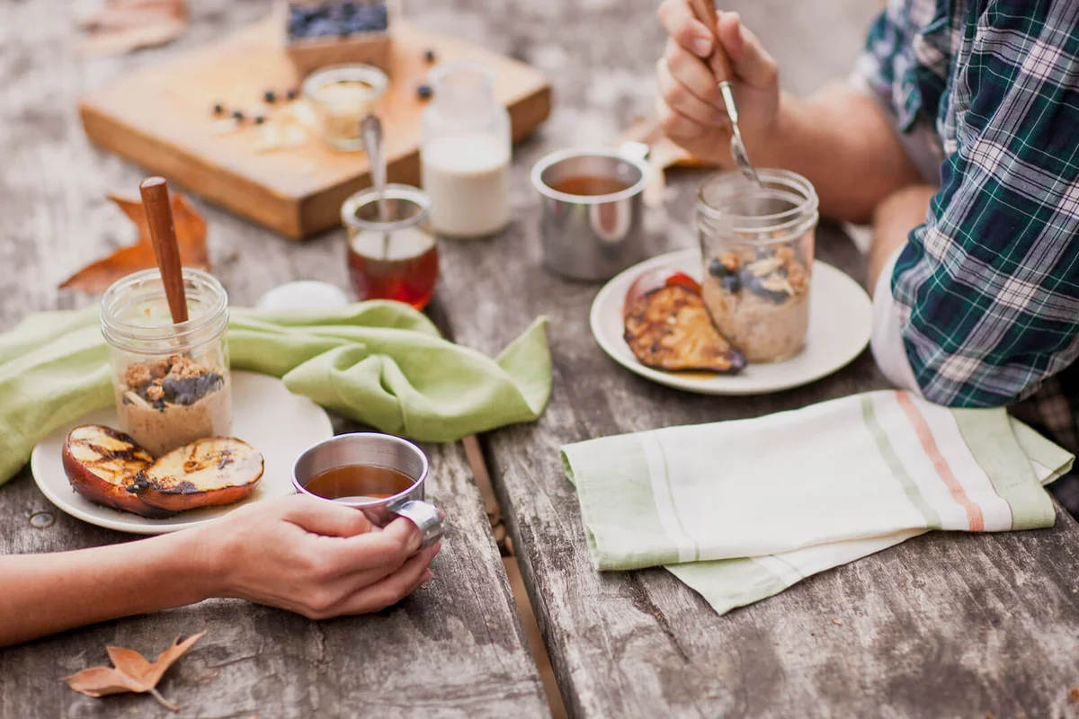 Couple with oatmeal and fruit