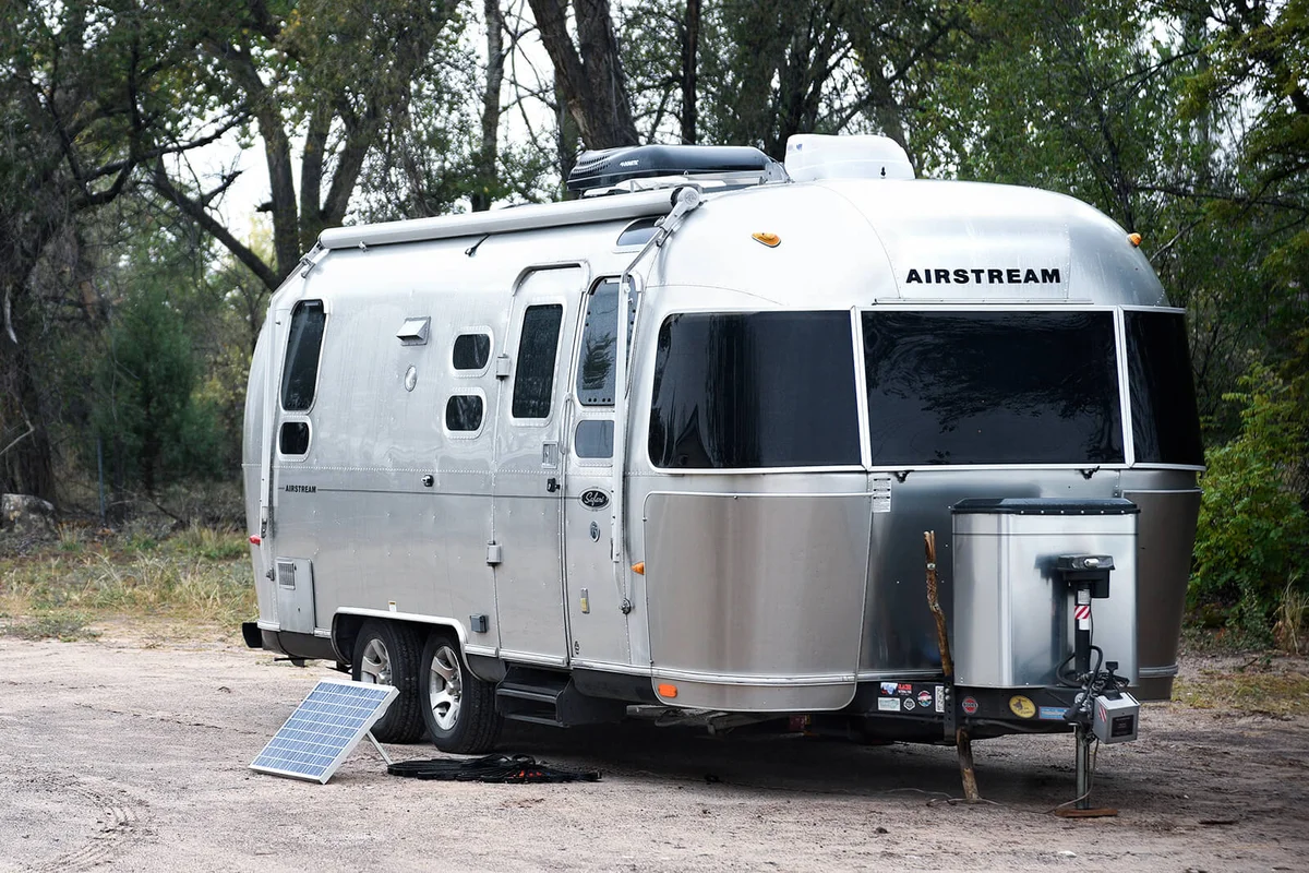 An Airstream travel trailer with a solar panel kit parked in Ojo Caliente, New Mexico | Getty Editorial Use