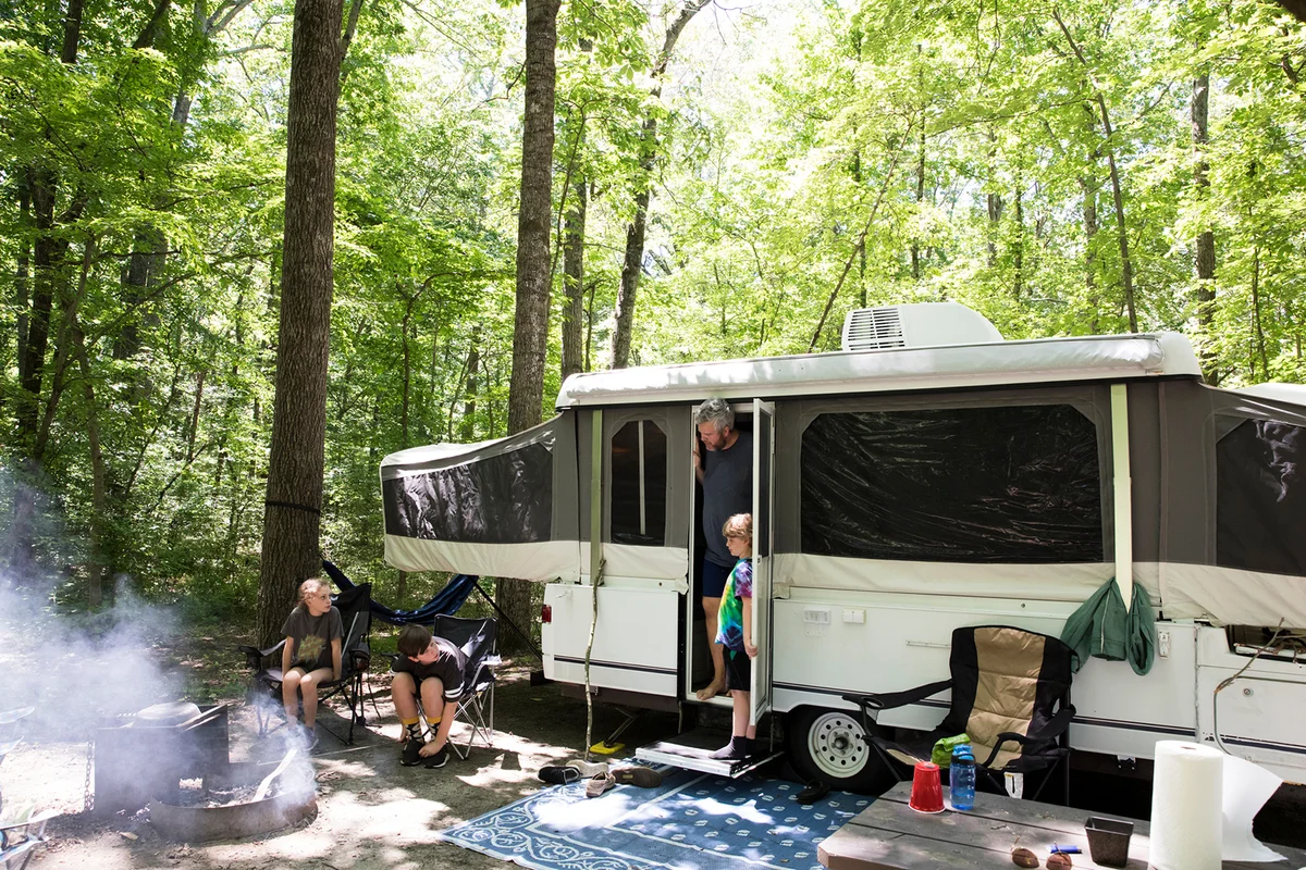 Pop Up Camper at Campsite on Family Camping Trip