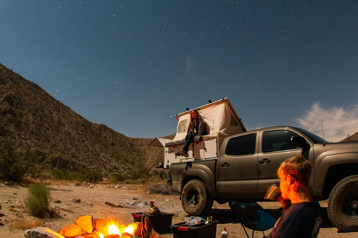 Couple enjoying a campfire on vacation