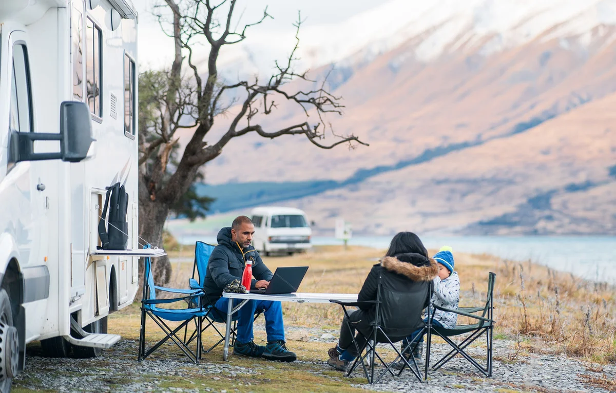 family camping with their RV in winter
