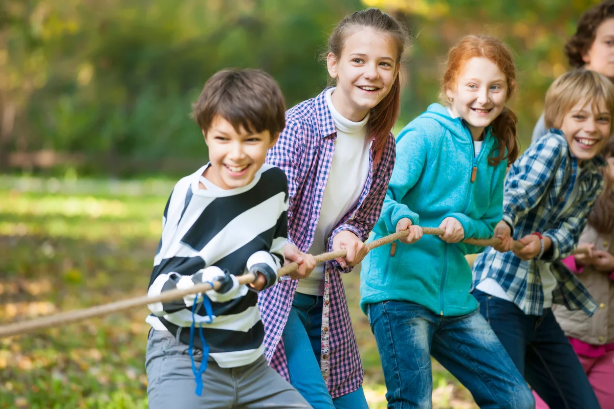 Group of kids in a tug-of-war game