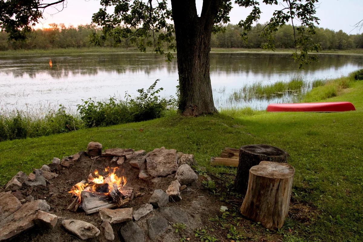 Canoe and Campfire by the River