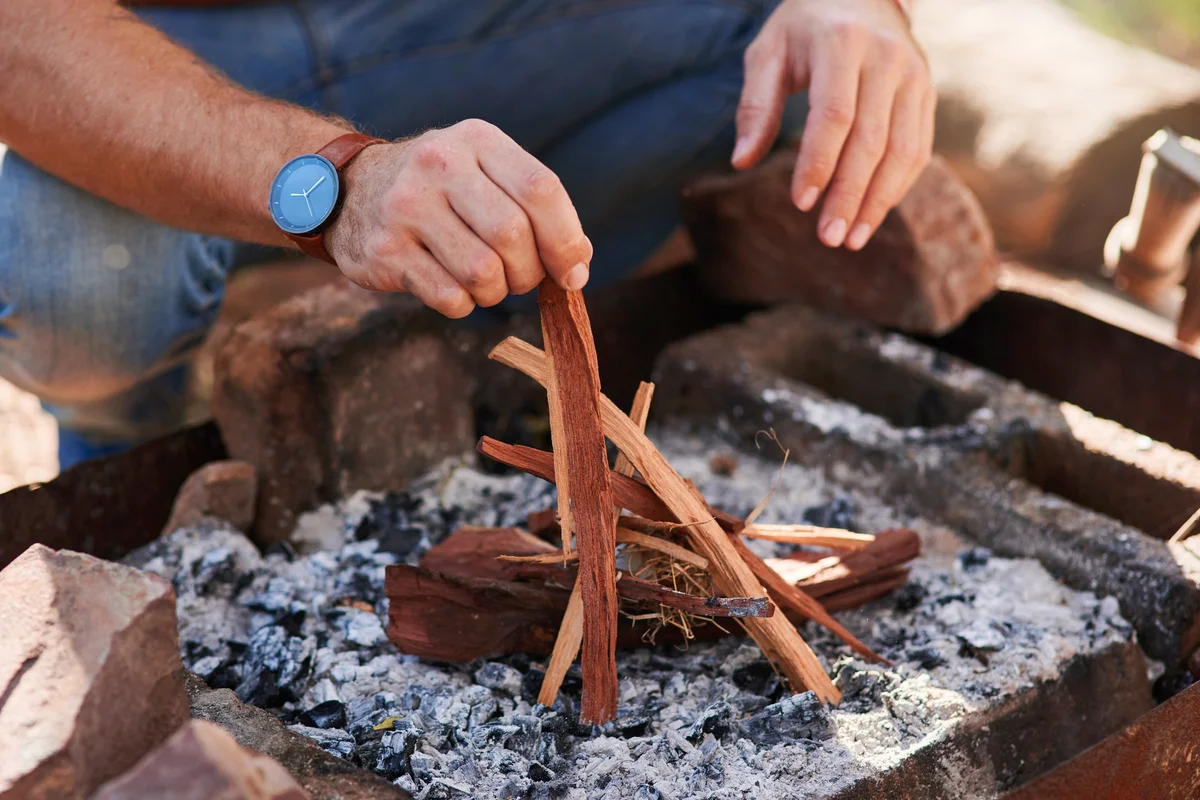 Man lighting a fire