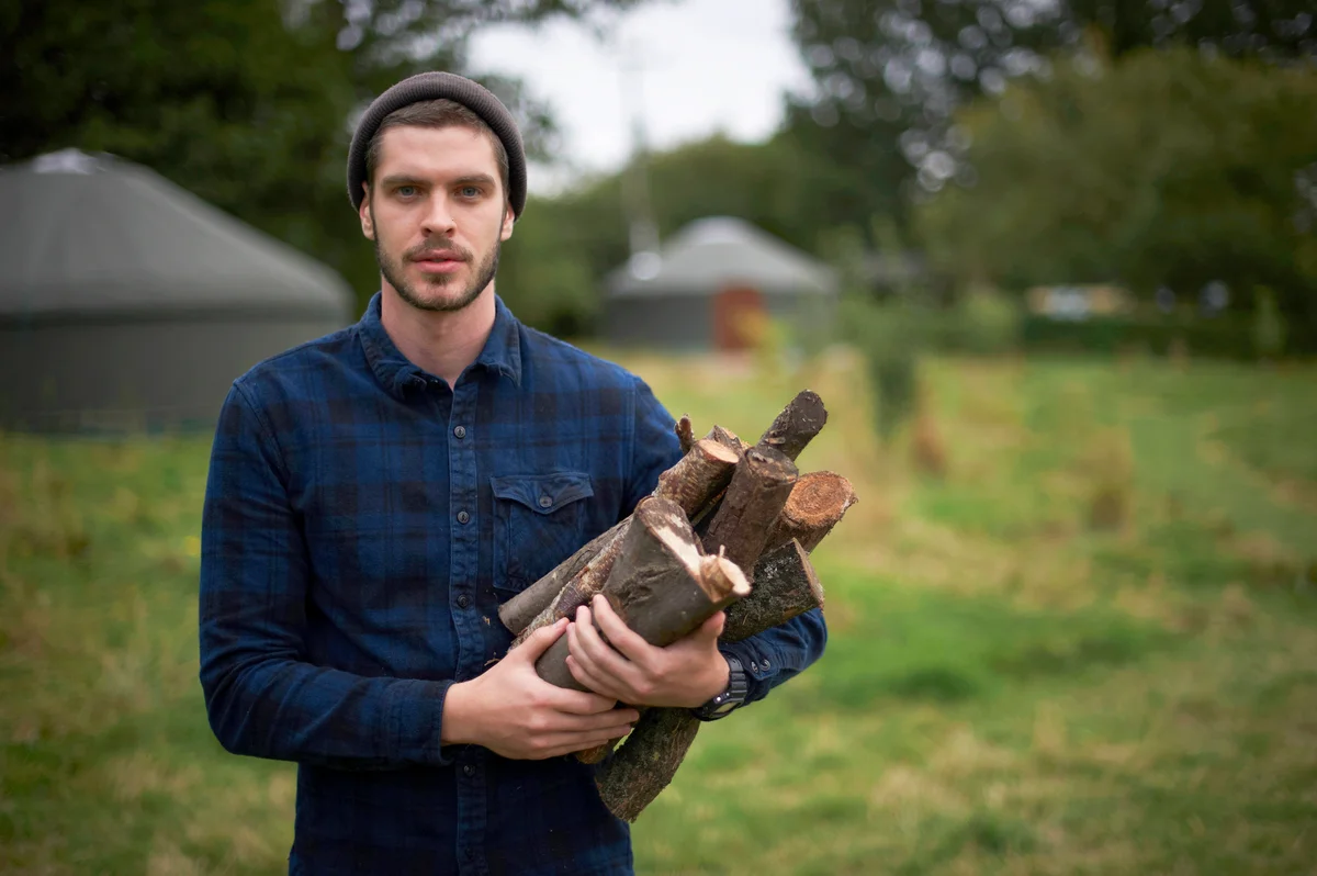 Man holding firewood