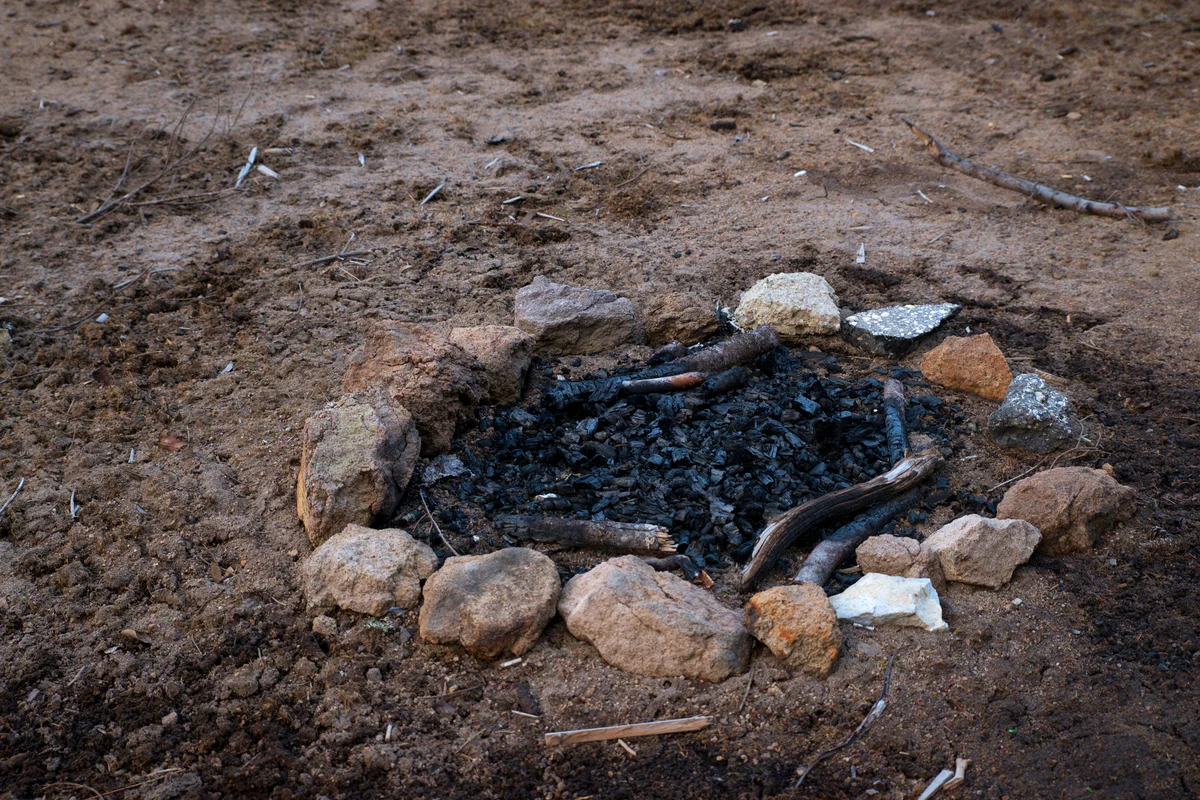 Extinguished camp fire