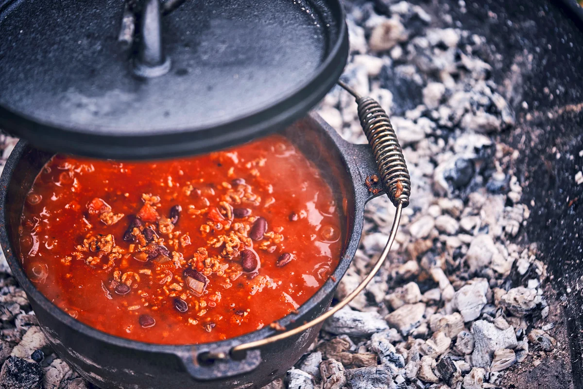 Cooking Chili Con Carne in Dutch Oven over Logfire
