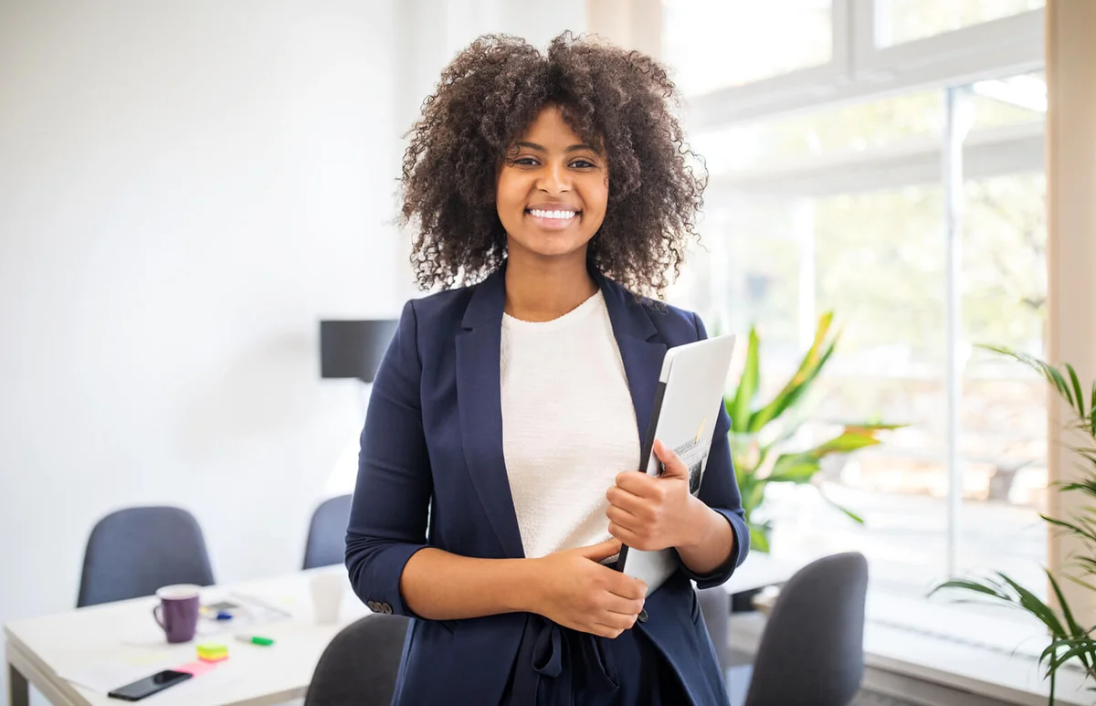 Portrait of confident businesswoman with laptop