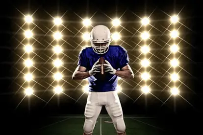 Football player holding ball