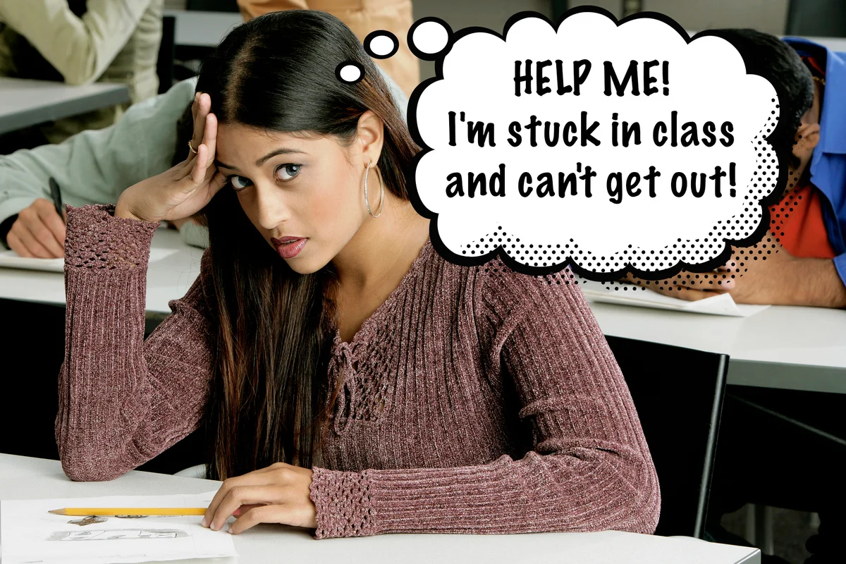 young woman sitting in a class looking frustrate