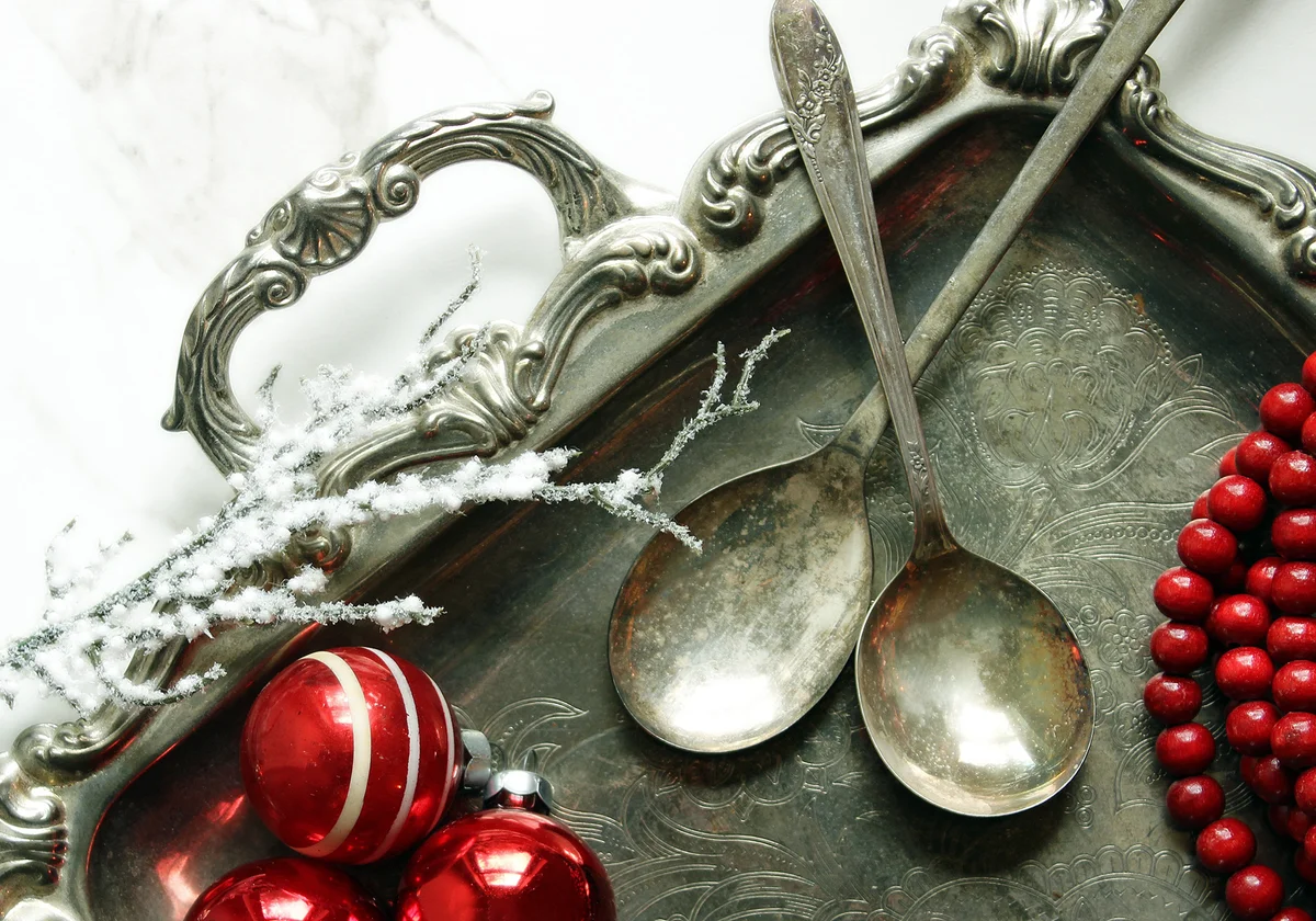 Silver Spoons With Beads And Christmas Decorations In Tray