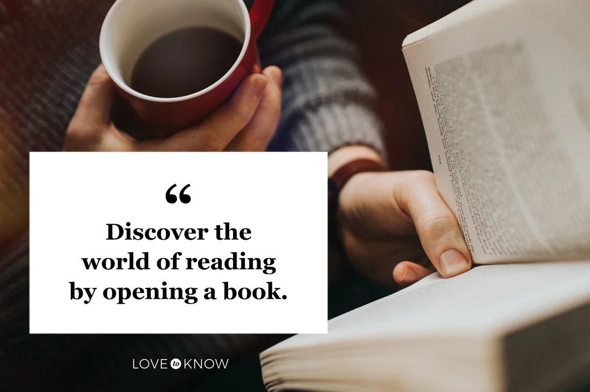 Man reading a book and drinking a hot drink from a red mug