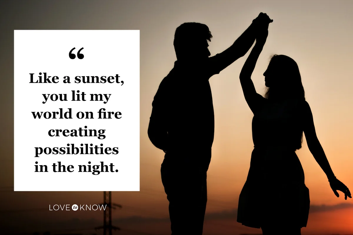 Romantic couple dancing together at sunset