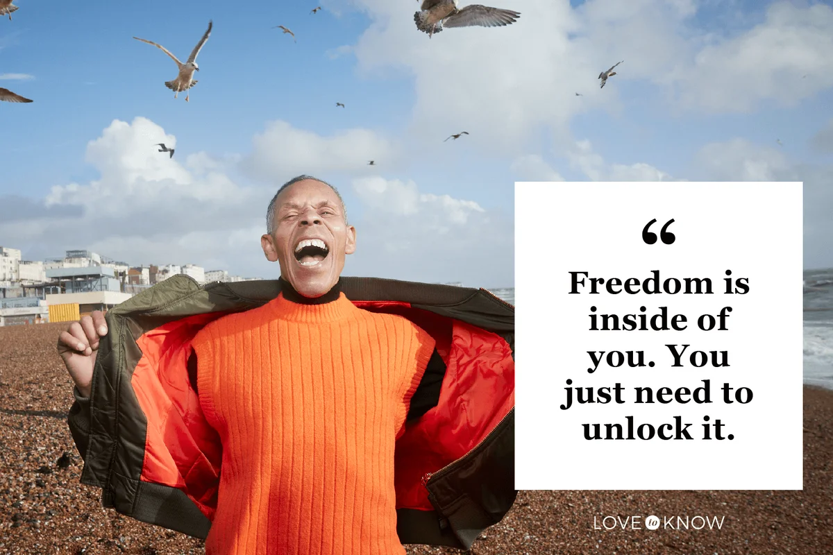 Senior man screaming while birds flying at beach