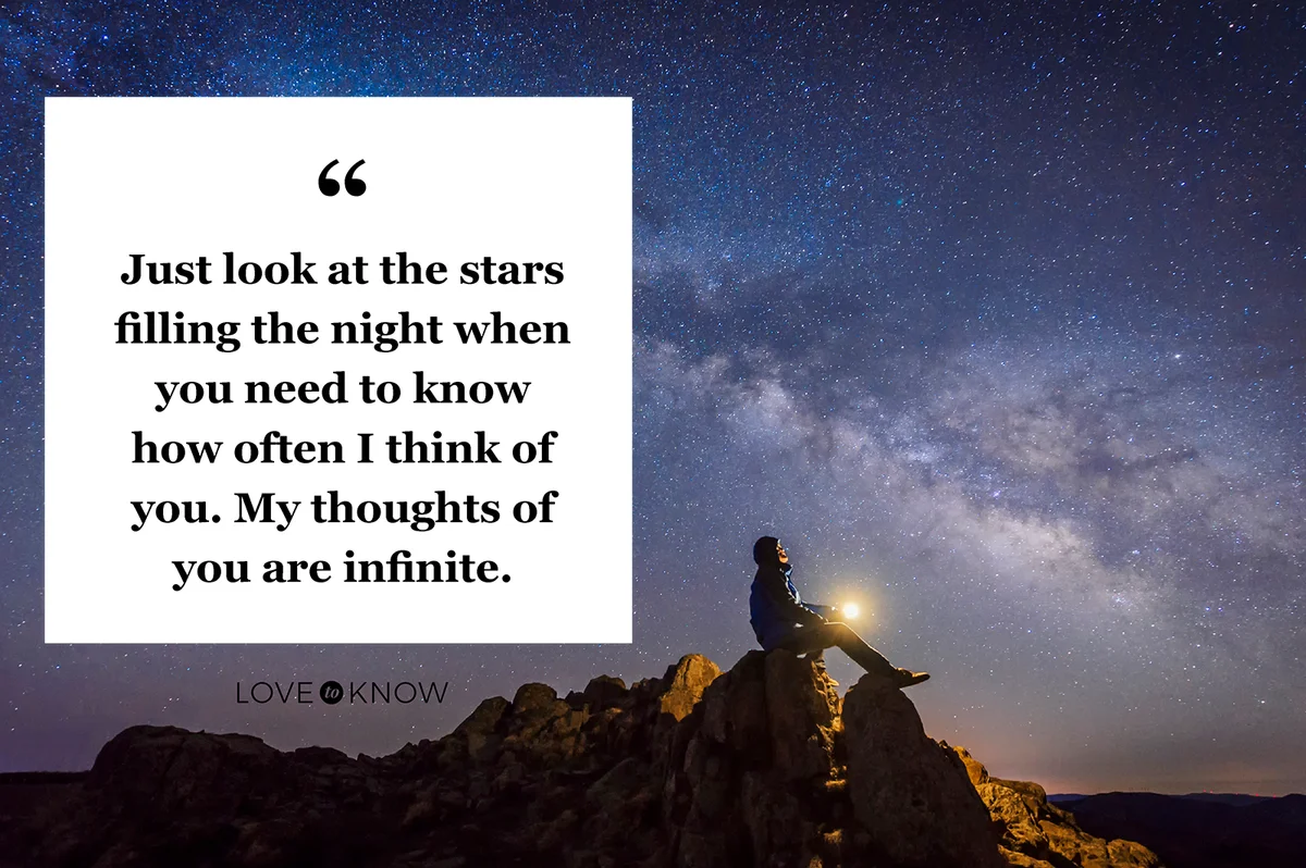 Man sitting under The Milky Way Galaxy