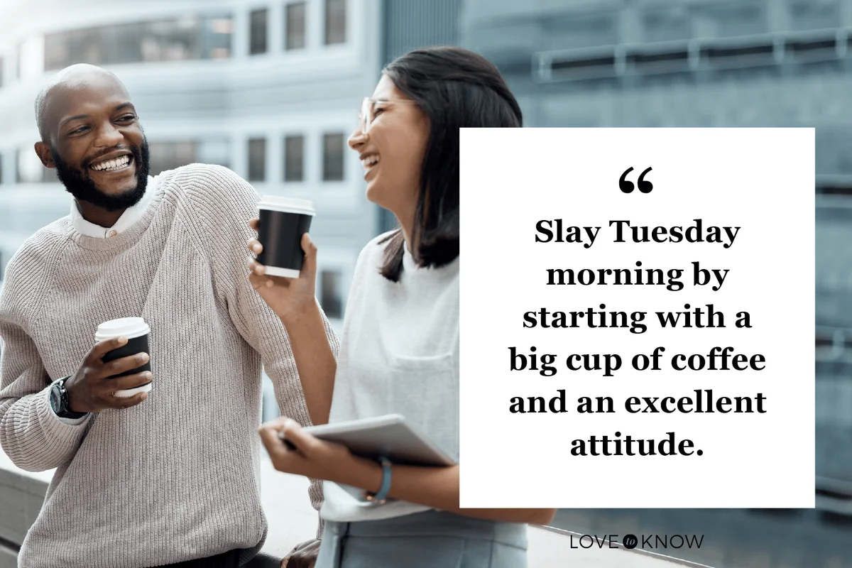 two businesspeople drinking coffee together outside an office