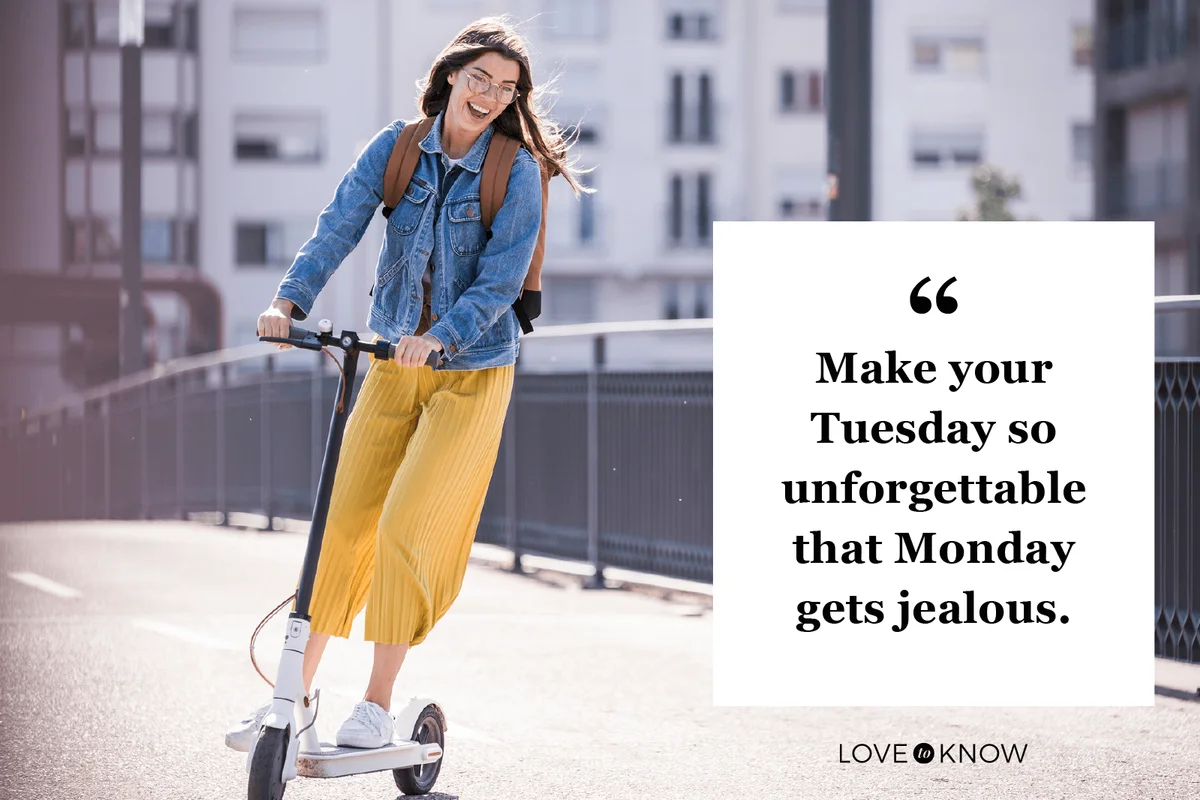 Happy young woman riding electric scooter on a bridge