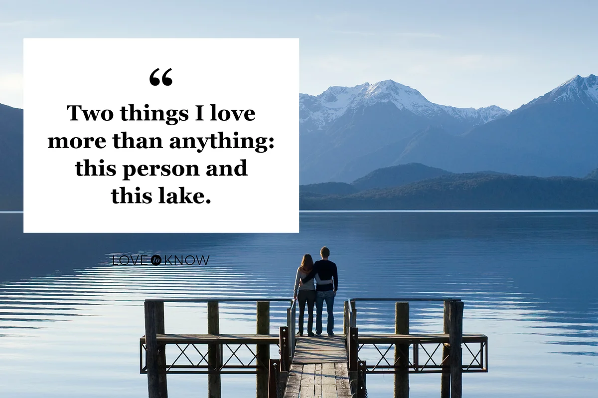 Young couple standing on lake pier