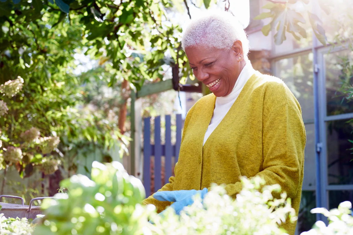 happy woman in her garden on spring day